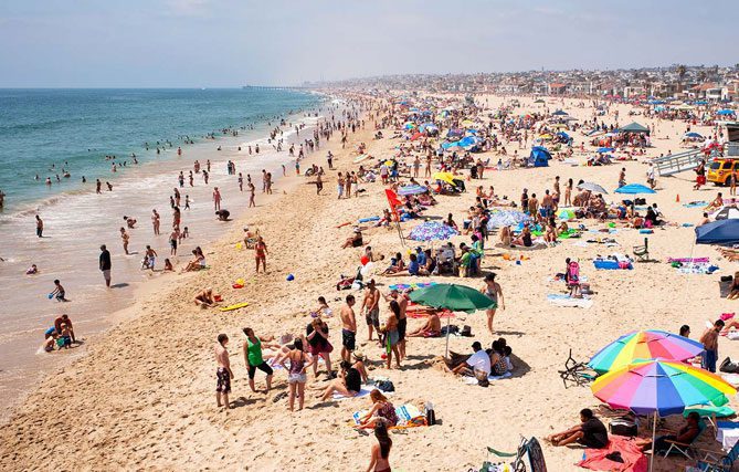 A crowded beach with many people on it