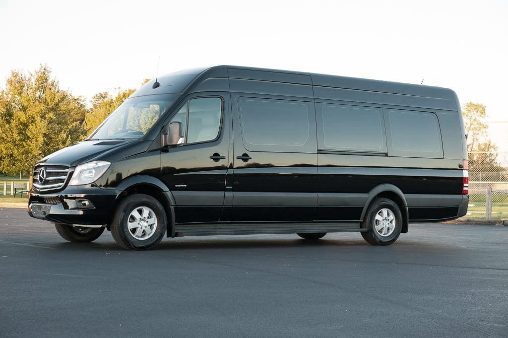 A black van is parked in the parking lot.