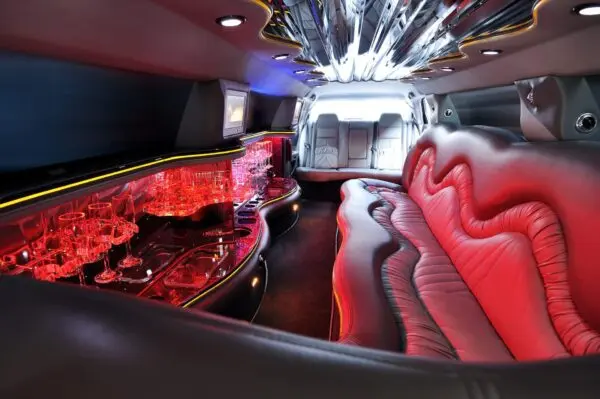 A red couch in the middle of a room.