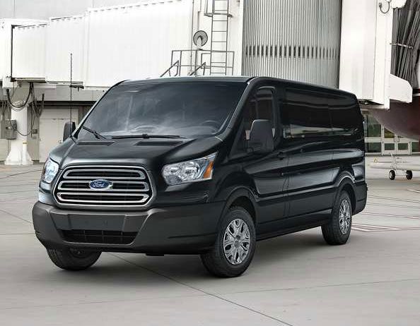 A black van parked in front of a building.