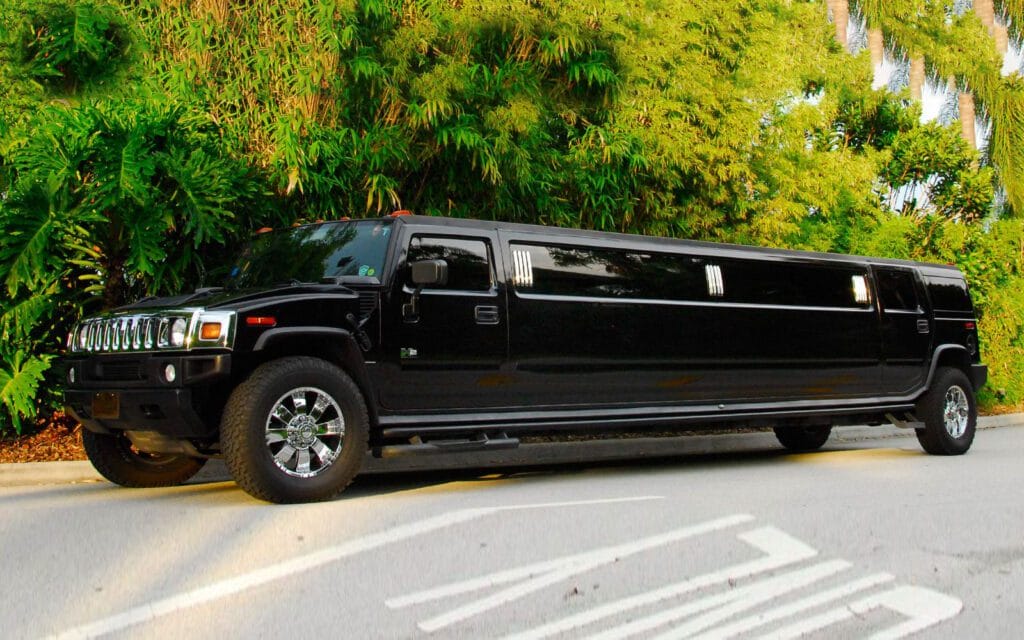 A black limo driving down the street