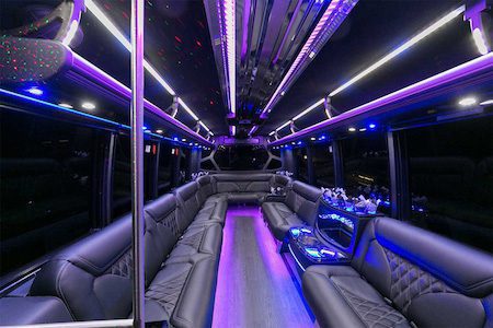 A bus with purple lights and leather seats.