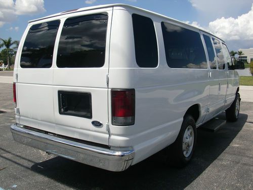 A white van is parked in the parking lot.