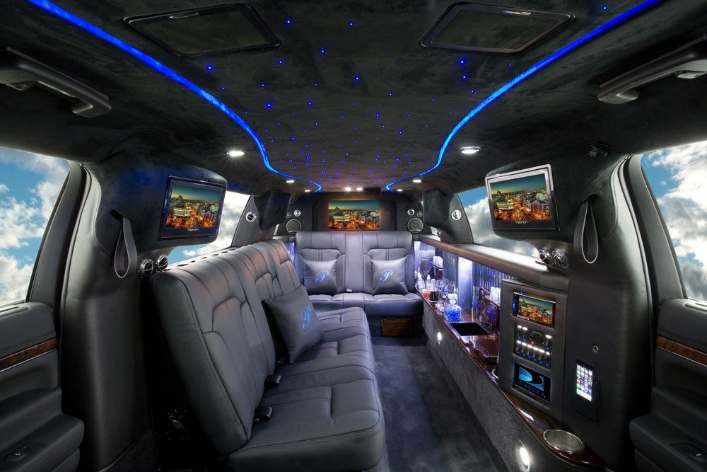 A limo with seats and tables in it