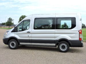 A white van is parked in the parking lot.