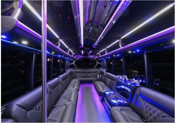 A bus with purple lights and leather seats.