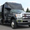 A black truck with a large open door.