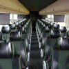 A bus with many seats in it