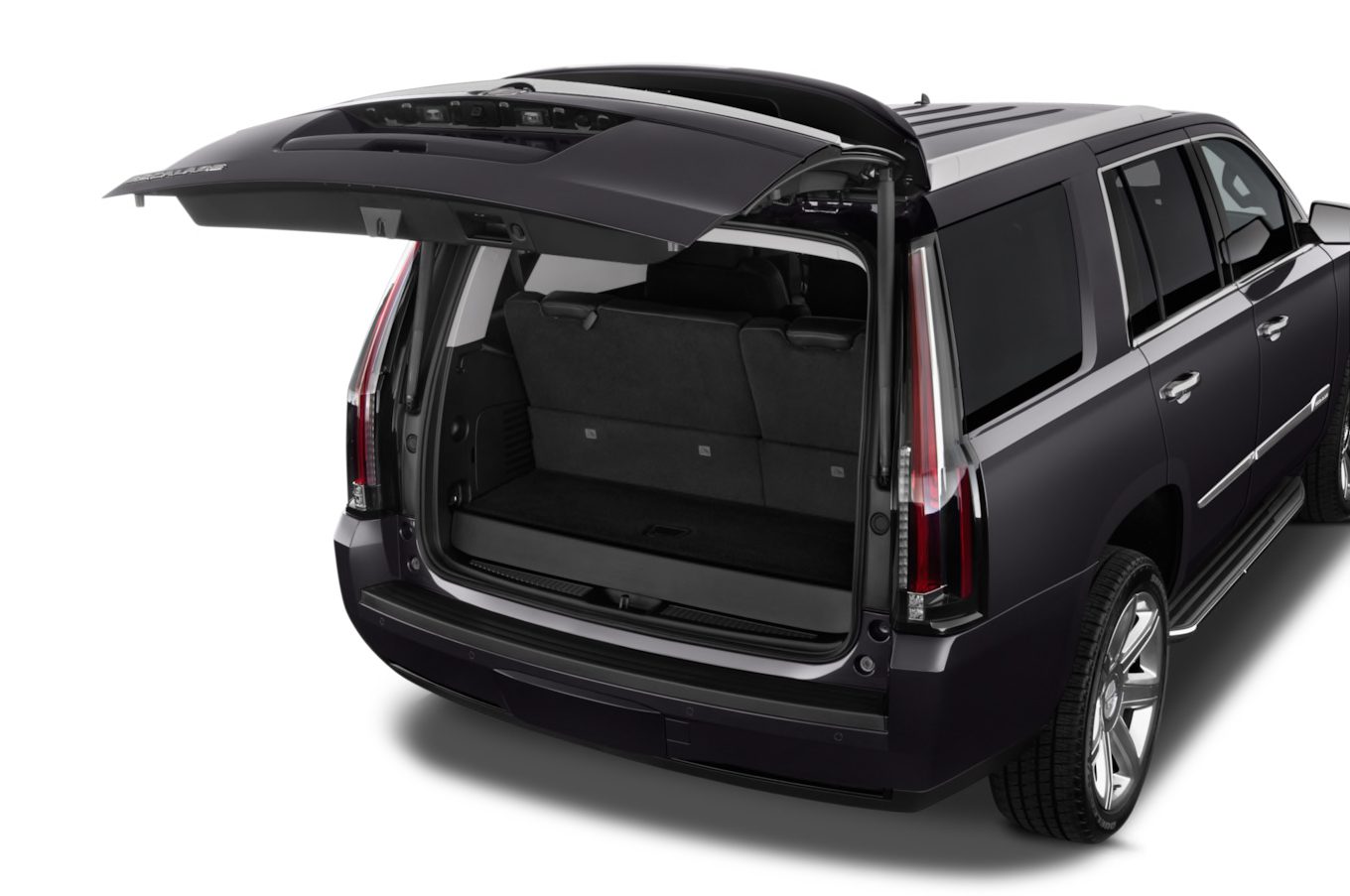 A black suv with its trunk open.