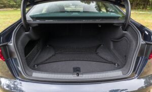 A trunk of a car with the floor in place.