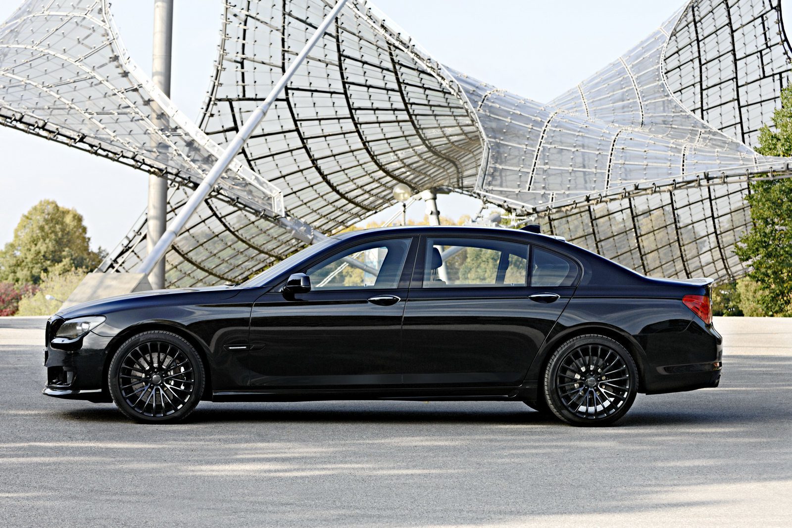 A black car parked in front of a building.