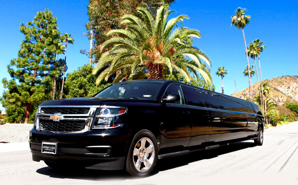 A black limo is parked on the side of the road.