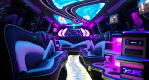 A limo with purple lights and white couches.