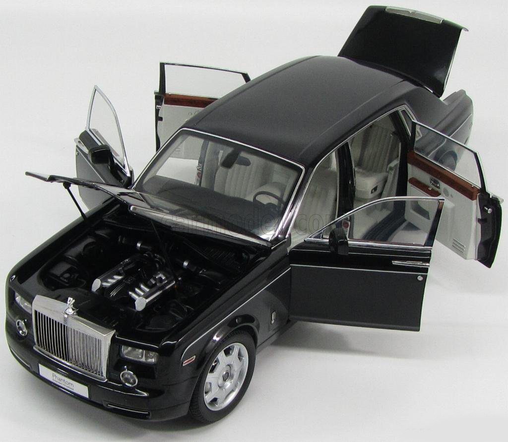 A black car with open doors and the hood up.