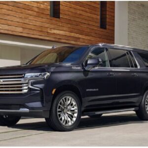 A black suv parked in front of a building.