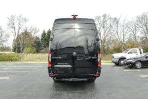 A black van parked in the parking lot