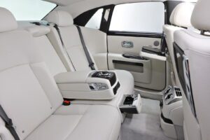 A car with white leather seats and black trim.