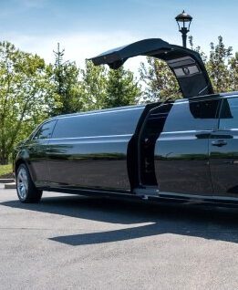 A black limo is parked in the street.