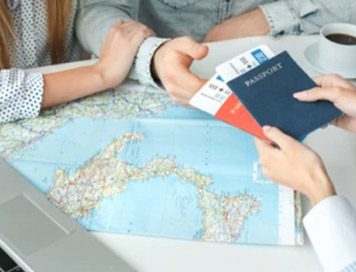 A group of people sitting around a map