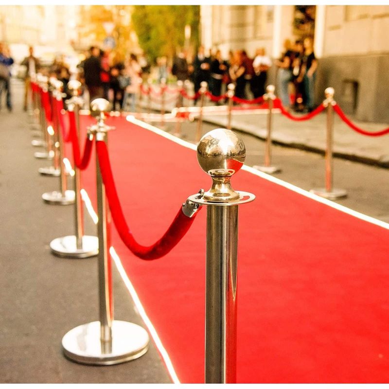 A red carpet is being used as a walkway.