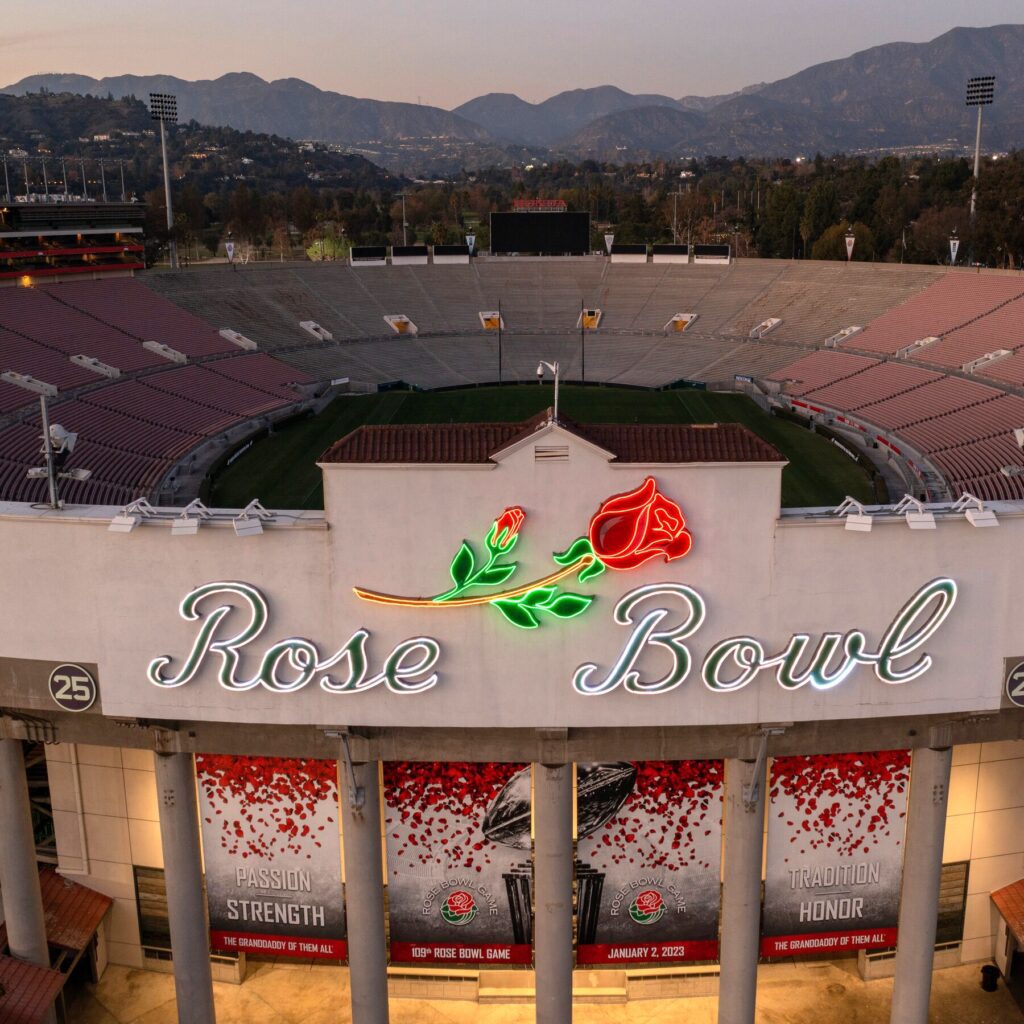 Rose Bowl stadium entrance with neon sign.